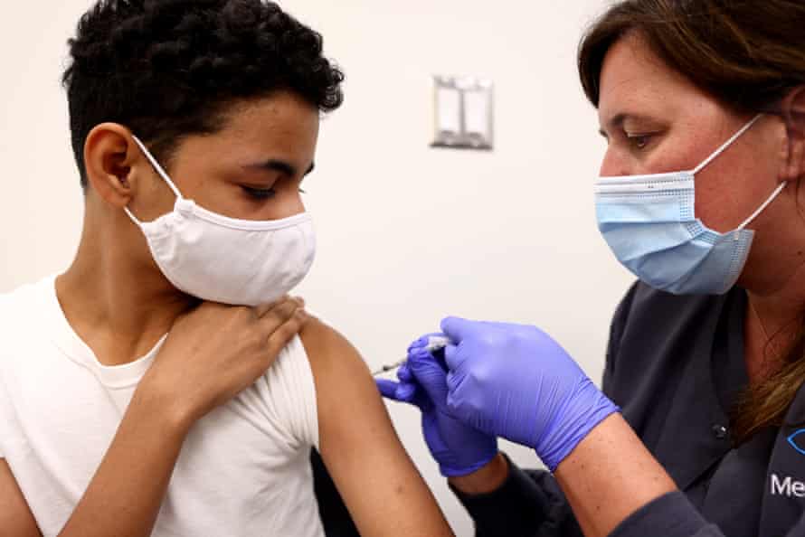 Laura Gaar administers a Covid vaccination to a 14 year old on 10 August.