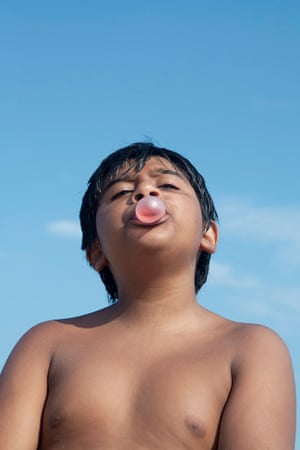 Photographs from the book Bubblegum by photographer Emily Stein showing children enjoying blowing bubblegum with frustration, excitement, surprise and concentration