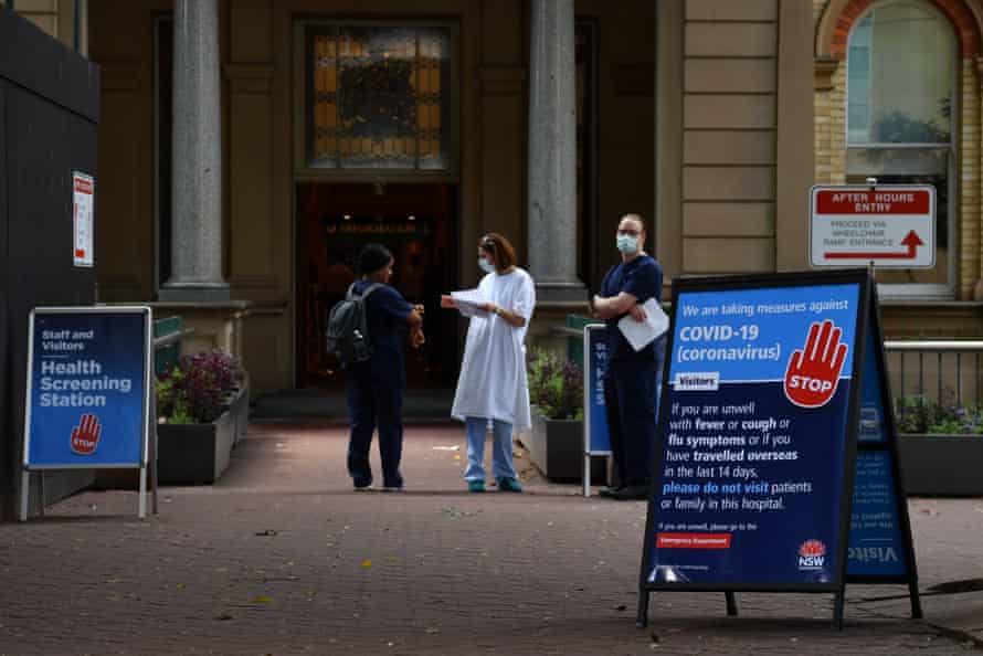 Staff wearing face masks outside the Royal Prince Alfred Hospital in Camperdown, Sydney.