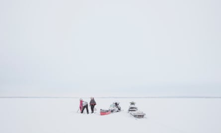 Jussa Seurujärvi ice-fishing with his father, Osmo, and sister, Maiju.