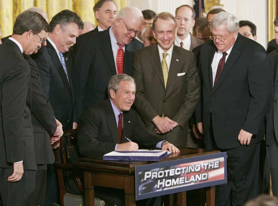 President George W Bush surrounded by members of Congress at a signing ceremony for the renewal of the USA Patriot and Terrorism Prevention Reauthorization Act on 9 March 2006.