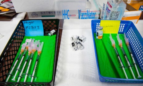 Needles preloaded with the Moderna and Pfizer Covid-19 vaccines sit in baskets awaiting patients at Hartford Hospital in Connecticut on 24 August 2021.