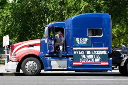 Demonstrators calling for fair broker fees for truck drivers rally outside the White House on 13 May 2020.