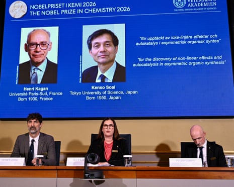 A screen shows Henri Kagan and Kenso Soai during the Nobel Prize in Chemistry announcement