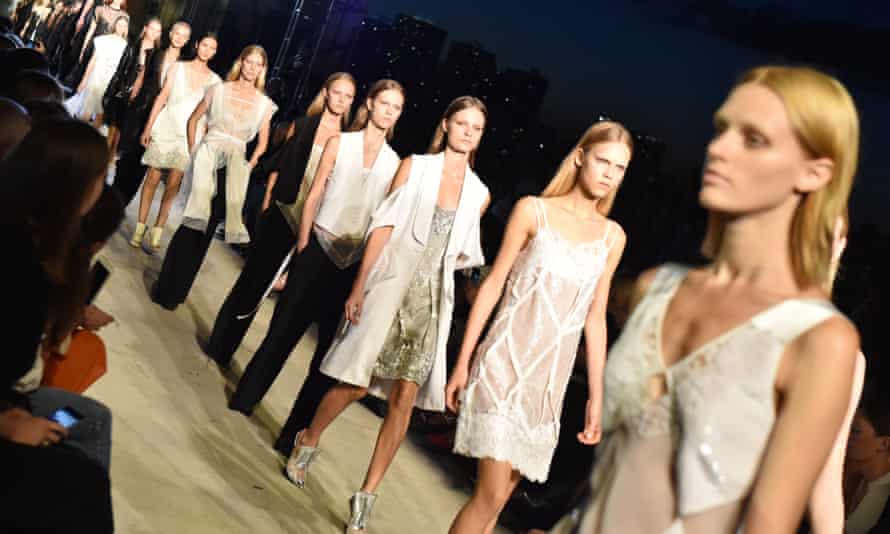 Models wear lace slips on the catwalk for the Givenchy show.