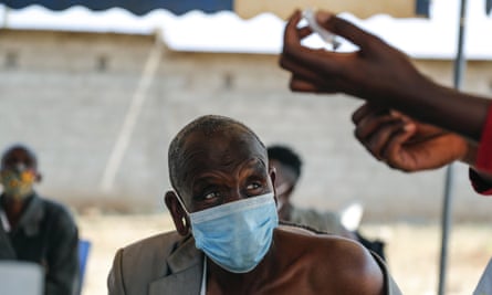 A man receives a dose of the AstraZeneca vaccine in Kimana, Kenya