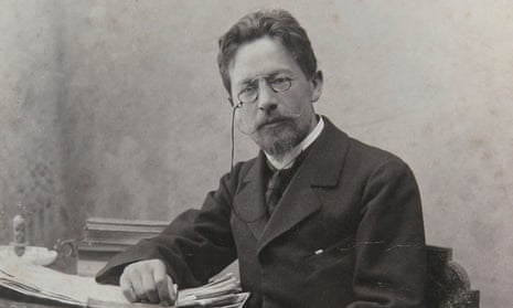 Anton Chekhov seated at a desk.