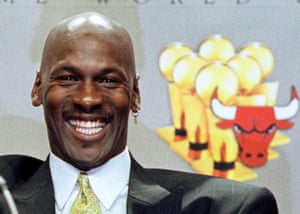 Michael Jordan smiles at a press conference in Chicago to announce his retirement in 1999.
