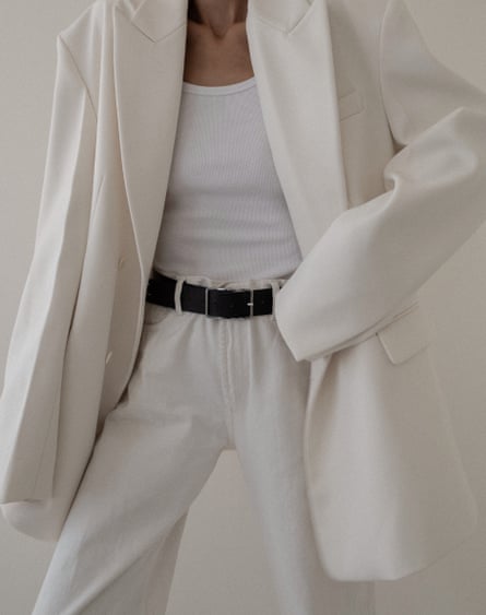 woman wearing white suit with belt