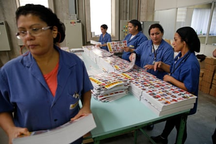 Women collecting sheets of players at the Panini factory just outside São Paulo in 2014.