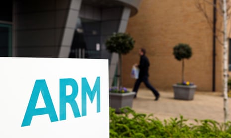 An employee enters the Arm Holdings Plc HQ in Cambridge, UK.
