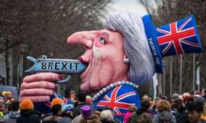 A float of the prime minister with a gun in her mouth saying Brexit