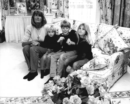Annabel Goldsmith sitting on a sofa with three of her children, Zac, Ben and Jemima