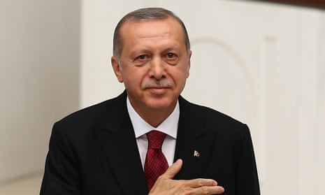 Turkish President Recep Tayyip Erdogan speaking at a podium
