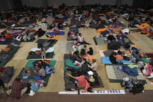 Migrants rest at a temporary Tijuana shelter near the US-Mexico border. Some of them have travelled for more than a month through Central America and Mexico