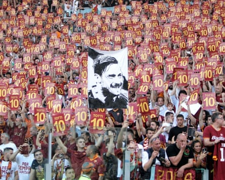 Roma supporters hold up Totti number 10 cards during Francesco Totti’s final match.