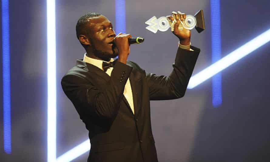Stormzy accepts his award for Best Grime Act during the Mobo awards 2015.
