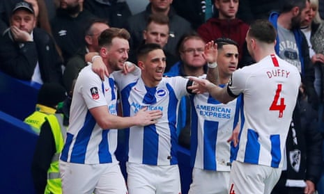Brighton’s Anthony Knockaert celebrates with teammates after scoring their first goal.