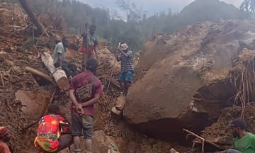 People digging at the site of the landslide at Mulitaka village in Papua New Guinea