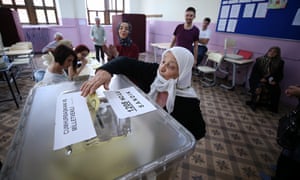 A voter casts her ballot at a polling station in Trabzon, Turkey.