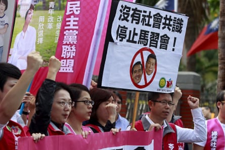Activists in Taipei protest against the meeting between the Taiwanese and Chinese presidents. The placard reads: ‘No society consensus; stop Ma-Xi meeting.’