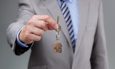 Man holding out house keys