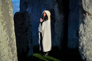 A woman has a moment to herself at Stonehenge