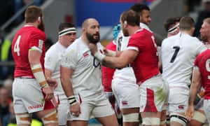 The England prop Joe Marler (centre left) and the Wales second-row Alun Wyn Jones during the match at Twickenham on Saturday.