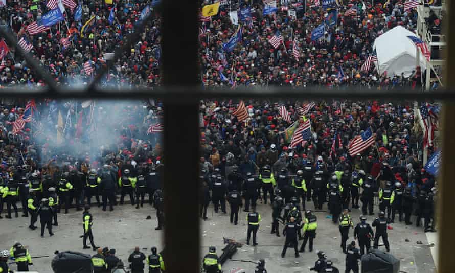 Police hold back supporters of Donald Trump as they gather outside the US Capitol’s Rotunda in Washington, 6 January.