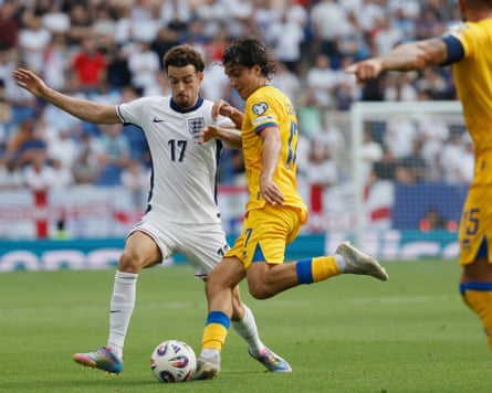 Curtis Jones competes for the ball for England