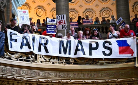 Protesters at the Missouri statehouse hold signs and a banner reading "Fair Maps."
