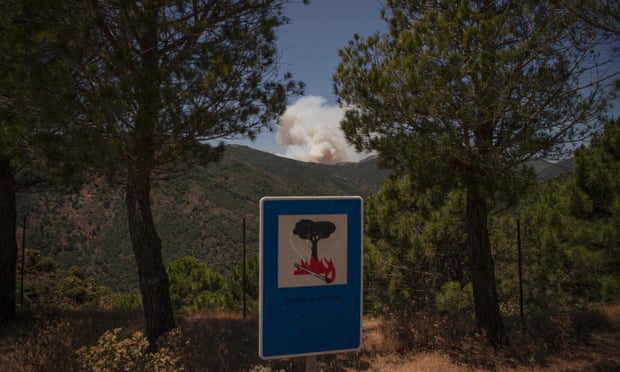 Smoke rises from a wildfire in Benahavís, Málaga province