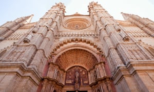 Palma Cathedral Entrance Facade“The entrance to the Cathedral of Santa Maria of Palma, Majorca, more commonly referred to as La Seu. It is a Gothic Roman Catholic Cathedral built in a Catalan style. Shown here is the magnificent doorway and entrance facade.”