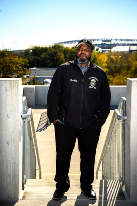 a man in a hat with his hands in his pants’ pockets