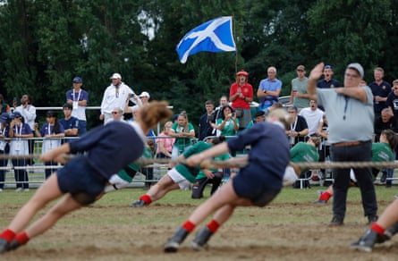 A Scotland supporter cheers on his team in the women’s U23 500kg category in which they won bronze.