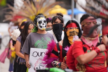 people hold signs outside