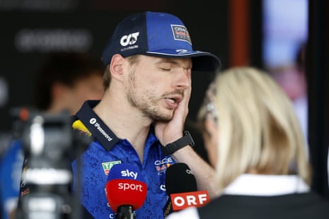 Max Verstappen clutches his face as he is interviewed after the British Grand Prix