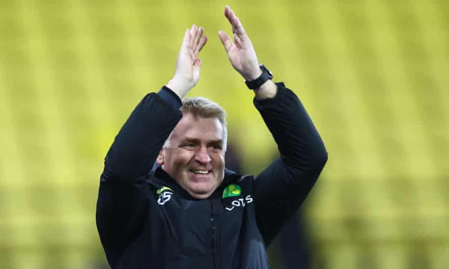 A beaming Norwich manager Dean Smith celebrates after the final whistle.