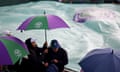 Spectators with umbrellas at Wimbledon