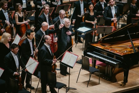 The pianist Radu Lupu, centre, with conductor Paavo Järvi and the Philharmonia at the Royal Festival Hall.