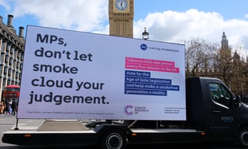 A campaign sign by Cancer Research UK outside parliament on 16 April.