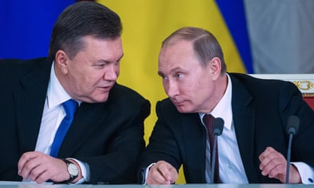 The then president of Ukraine, Viktor Yanukovych chats to Vladimir Putin in Moscow, 17 December 2013.
