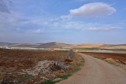 Landscape view of farmlands with the village in the distance