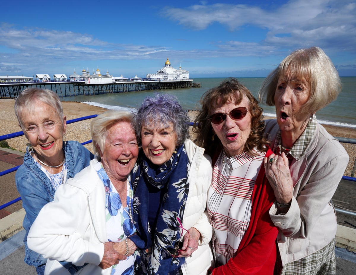 Five old friends who used to be showgirls, on the seafront in Eastbourne, UK
