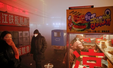 Street food customers endure smog in the city of Shengfang 