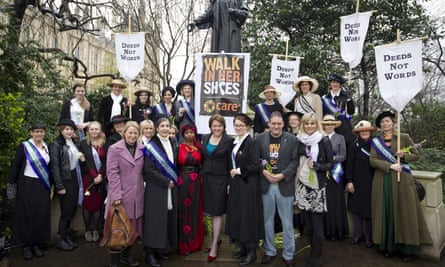 Miller with women dressed as suffragettes for poverty charity Care International’s Walk in Her Shoes campaign, March 2013