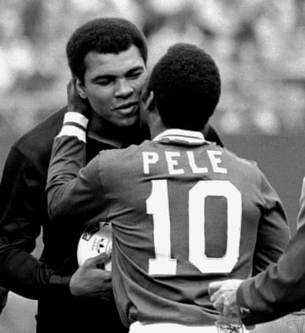 Pelé embraces the boxer Muhammad Ali during a ceremony honouring the Brazilian in 1977