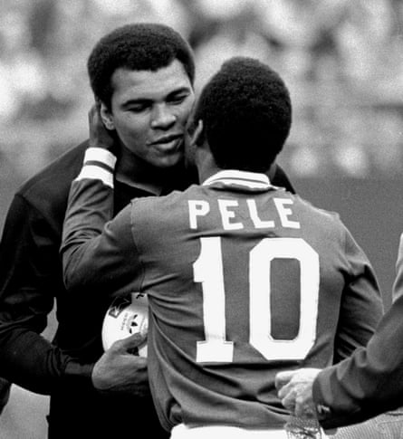 Pelé embraces the boxer Muhammad Ali during a ceremony honouring the Brazilian in 1977