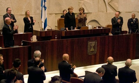 Chancellor Angela Merkel receives a standing ovation