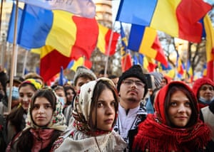 Girls wearing traditional outfits from the northern Romanian region attend a protest against the anti-Covid vaccine passport in Bucharest.
